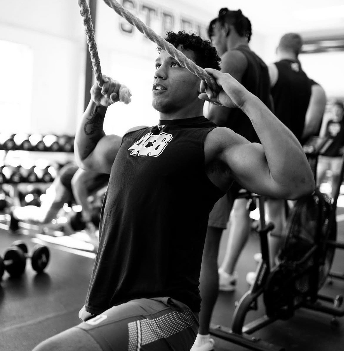 Minaya Olivo performing a rope pull during strength training